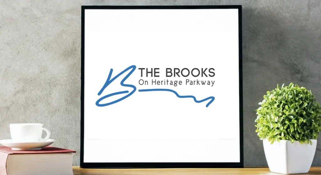 The Brooks on Heritage Parkway logo in picture frame on shelf.